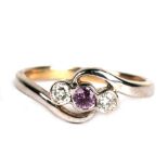 A 9ct white gold ring set with a central pink tourmaline flanked by two diamonds, approx UK size '