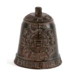 A Chinese bronzed cast iron bell decorated with bats, 11cms (4.25ins) high.