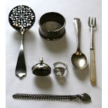 A silver sugar sifter; together with two silver rings; a silver bracelet and other items.