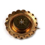 A late 19th century 15ct gold diamond set target brooch with glazed back, 6.7g. 3cm (1.2 ins)