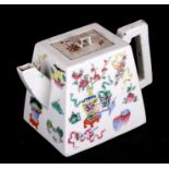 A Chinese famille rose teapot decorated with precious objects, of square tapering form, 10cms (4ins)