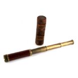 A late 19th century Dolland three-draw pocket telescope in leather case.