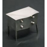 An Edwardian novelty silver ring box modelled as chest of drawers with a velvet lined interior to