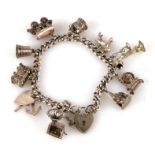 A silver charm bracelet with eleven charms, 48.2g.