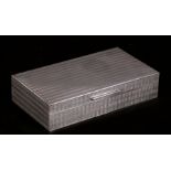 A continental 800 grade silver table cigarette box with engine turned decoration, 18cms (7ins)