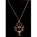 An ornate Edwardian 9ct gold pendant on chain, set with a single central topaz. weight 3.1g. Chain