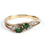 A 9ct gold emerald and diamond ring. Approx UK size N