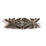 A Continental white metal and old cut diamond bow brooch. 5cm (2 ins) wide.