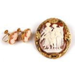 A pair of 9ct gold screw back cameo earrings; together with a yellow metal mounted cameo brooch (