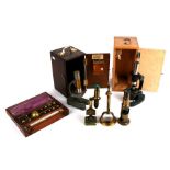 A group of microscopes to include an early 20th century lacquered brass student's microscope,a bulls