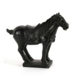 A Chinese Tang style stone horse, 24cms (9.5ins) high.