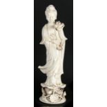 A large 19th century Chinese blanc de chine figure depicting Guanyin, 52cms (20.5ins) high.