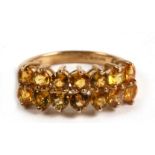 A 9ct gold and fourteen stone citrine double row ring, 3.3g. Approx. UK size N.