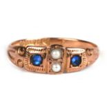 An Edwardian 9ct rose gold gypsy style ring set with two sapphires and two pearls, approx UK size '