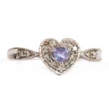 A 9ct white gold amethyst and diamond set heart shaped ring, approx UK size 'V'.