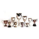 A quantity of silver plate trophies including '1929 Guard's Depot Tug of War'.