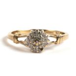 A 9ct gold and diamond cluster ring, 1.5g. Approx. UK size N.