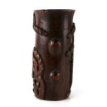 A Chinese bamboo brush pot decorated with a fo dog and prunus, 28cms (11ins) high.