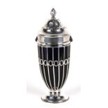 An Edwardian silver sugar caster with blue glass liner, London 1902, 17cms (6.75ins) high.