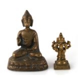 A cast brass Buddha seated in meditation, 14cms (5.5ins) high; together with an Indian brass