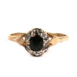 A 9ct gold, sapphire and diamond cluster ring, 1.7g. Approx. UK size M.