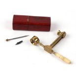 A early 19th century folding field entomologists microscope with turned ivory handle, with tools and