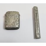 A Victorian silver vesta case, with engraved decoration throughout, Birmingham 1899, along with a