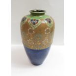 A 20th century Royal Doulton stoneware vase, on a blue glaze decorated with various flowers