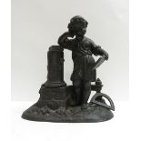 A 20th century spelter figure of a girl reading a book, 19cm high