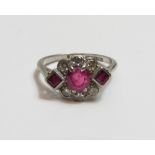 A ruby and diamond ring, the white mount stamped '18ct & Plat' , the cushion shaped ruby measuring