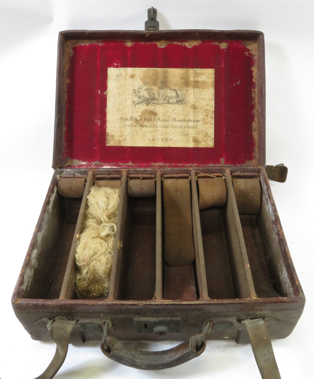 A leather six section gun cartridge case, bears paper label 'Boss and Co, Gun, Rifle & Breech loader