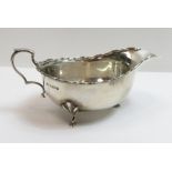 A silver sauceboat, with a shaped border, Birmingham 1926, Bros Ltd, 95 grams gross