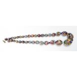 A Millefiori glass bead necklace, the 34 graduated oval beads in a single string to a base metal