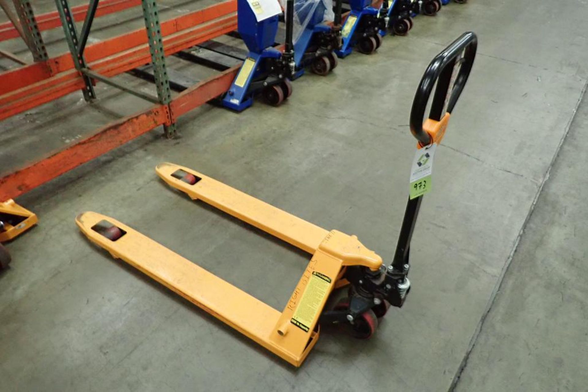 Global Industrial 5500 lb hand pallet jack, SN F695067, yellow. **Rigging Fee: $10**