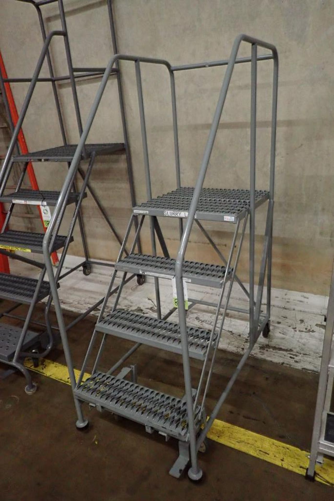 Cotterman 4-step mild steel rolling warehouse ladder. **Rigging Fee: $25** - Image 2 of 3