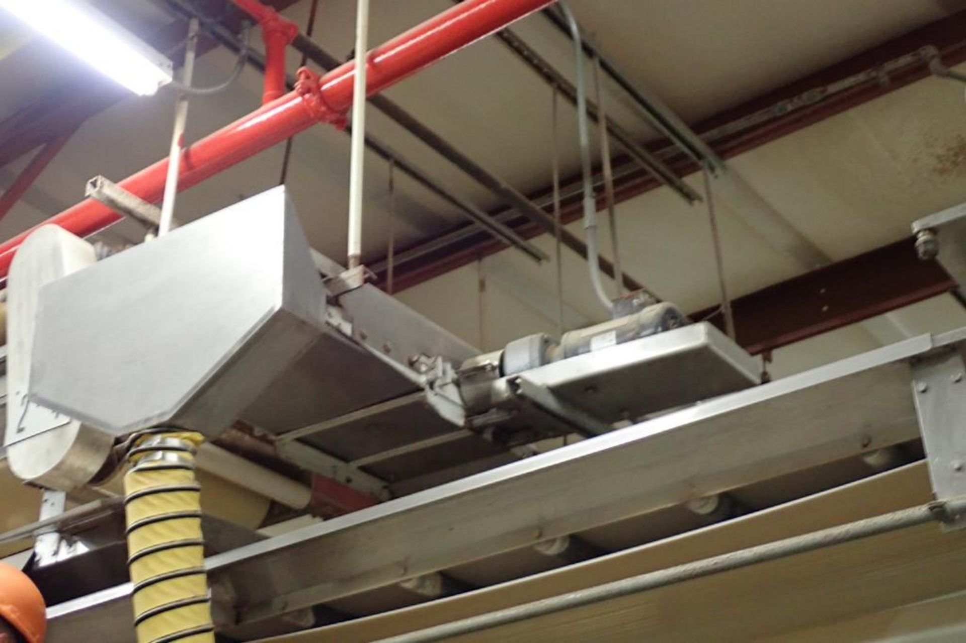 SS belt conveyor, 60 in. long x 18 in. wide, suspended from ceiling. **Rigging Fee: $250**