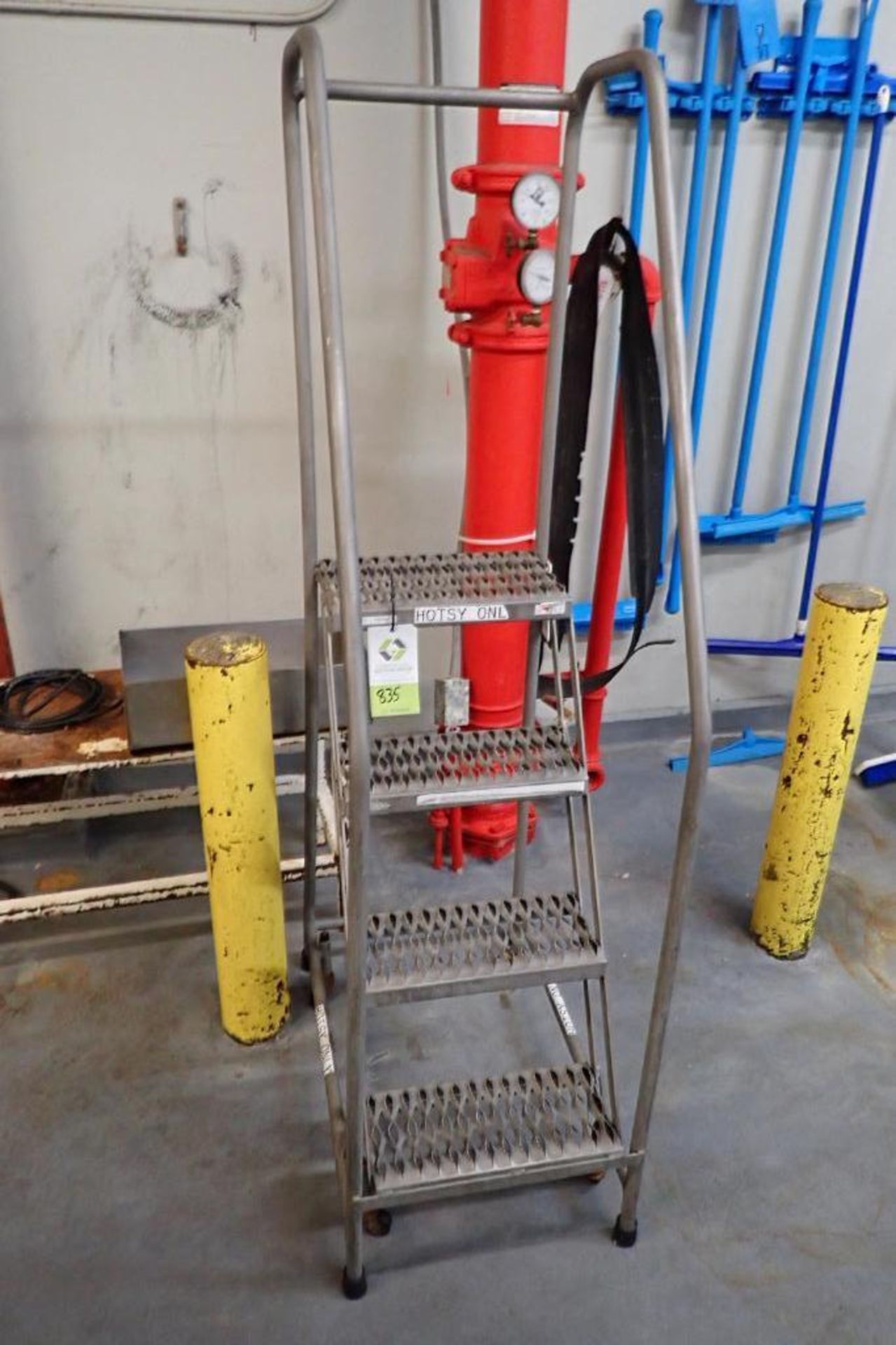 Cotterman 4-step stainless steel rolling warehouse ladder. **Rigging Fee: $10**
