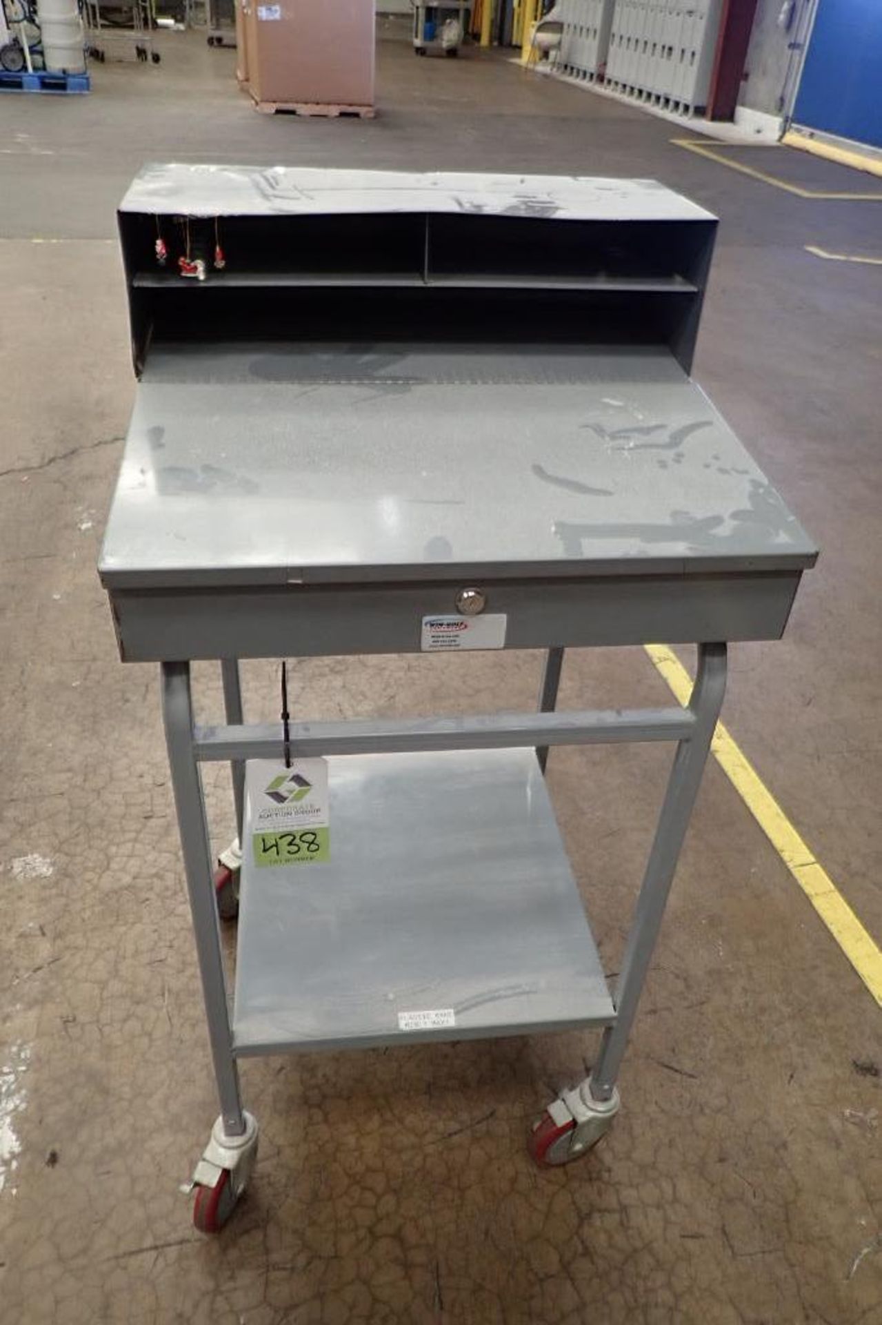 Win-Holt mild steel shipping desk on casters. **Rigging Fee: $10**