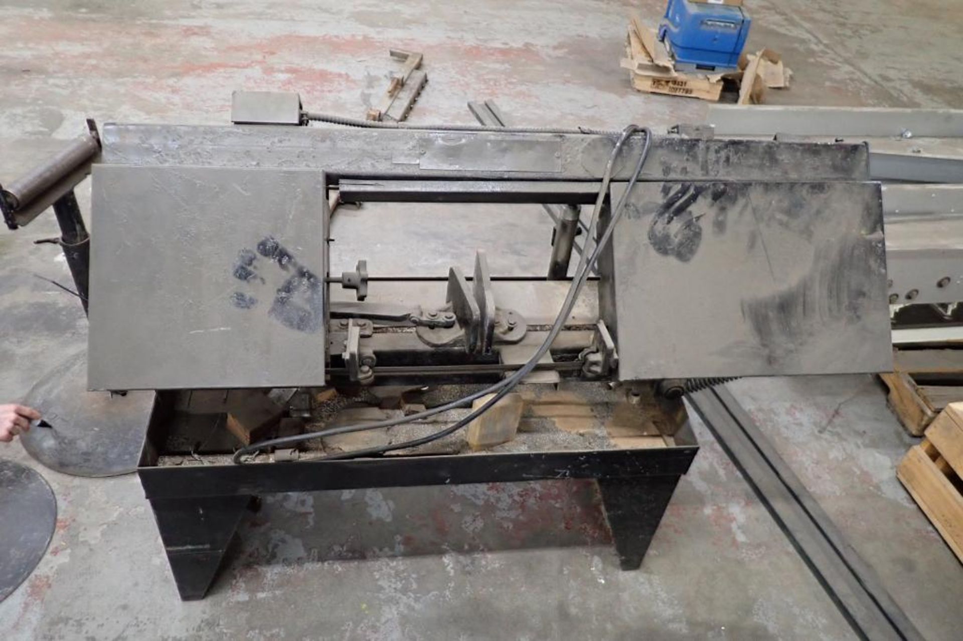 Horizontal band saw with 2 adjustable stands. **Rigging Fee: $75** - Image 2 of 10
