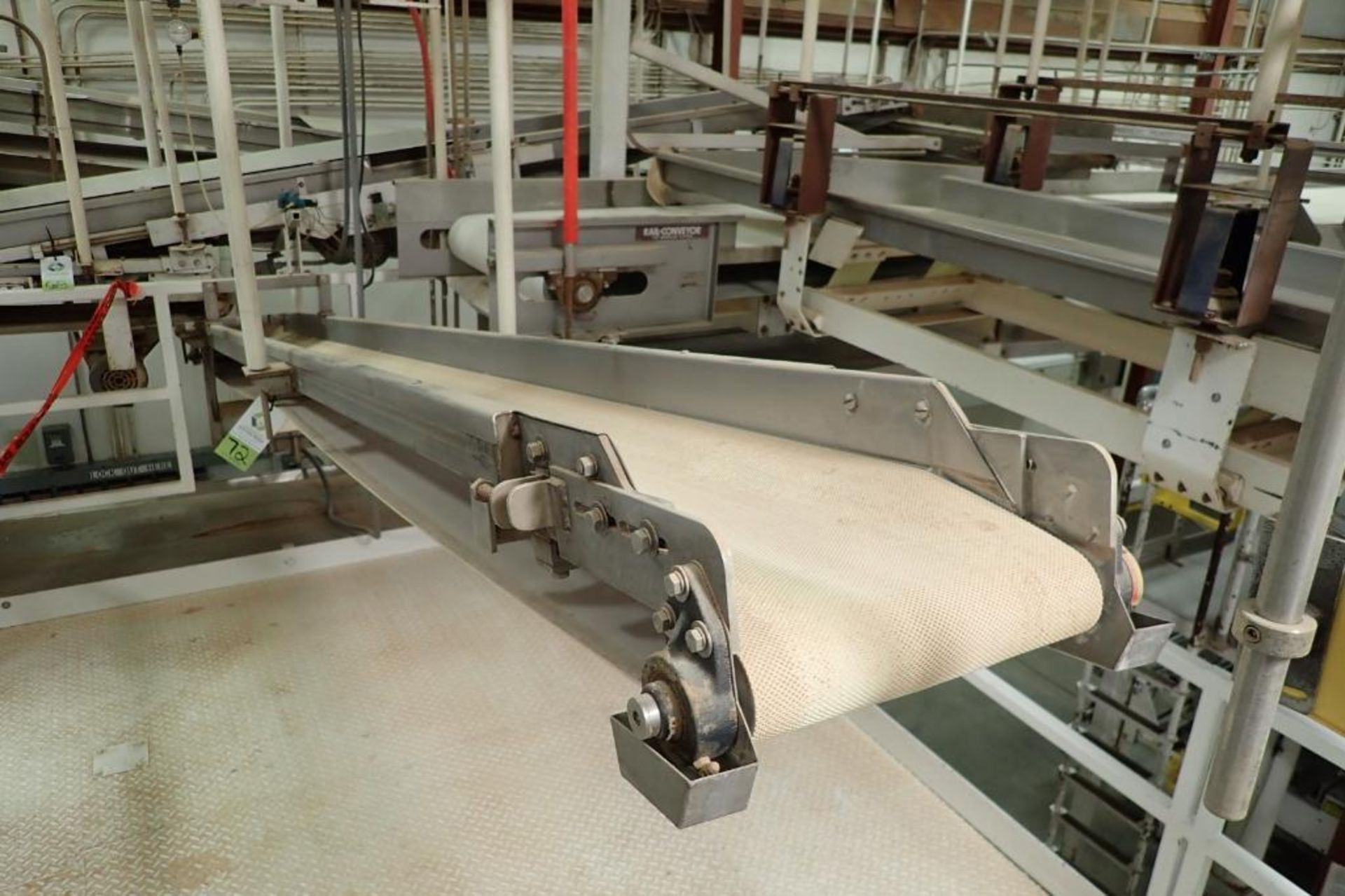 SS belt conveyor, 151 in. long x 12 in. wide, suspended from scale frame. **Rigging Fee: $300**