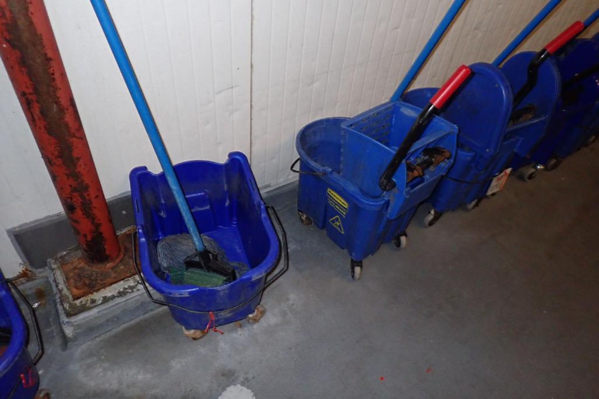 Blue mops and mop buckets, approximately 8. **Rigging Fee: $75** - Image 3 of 6