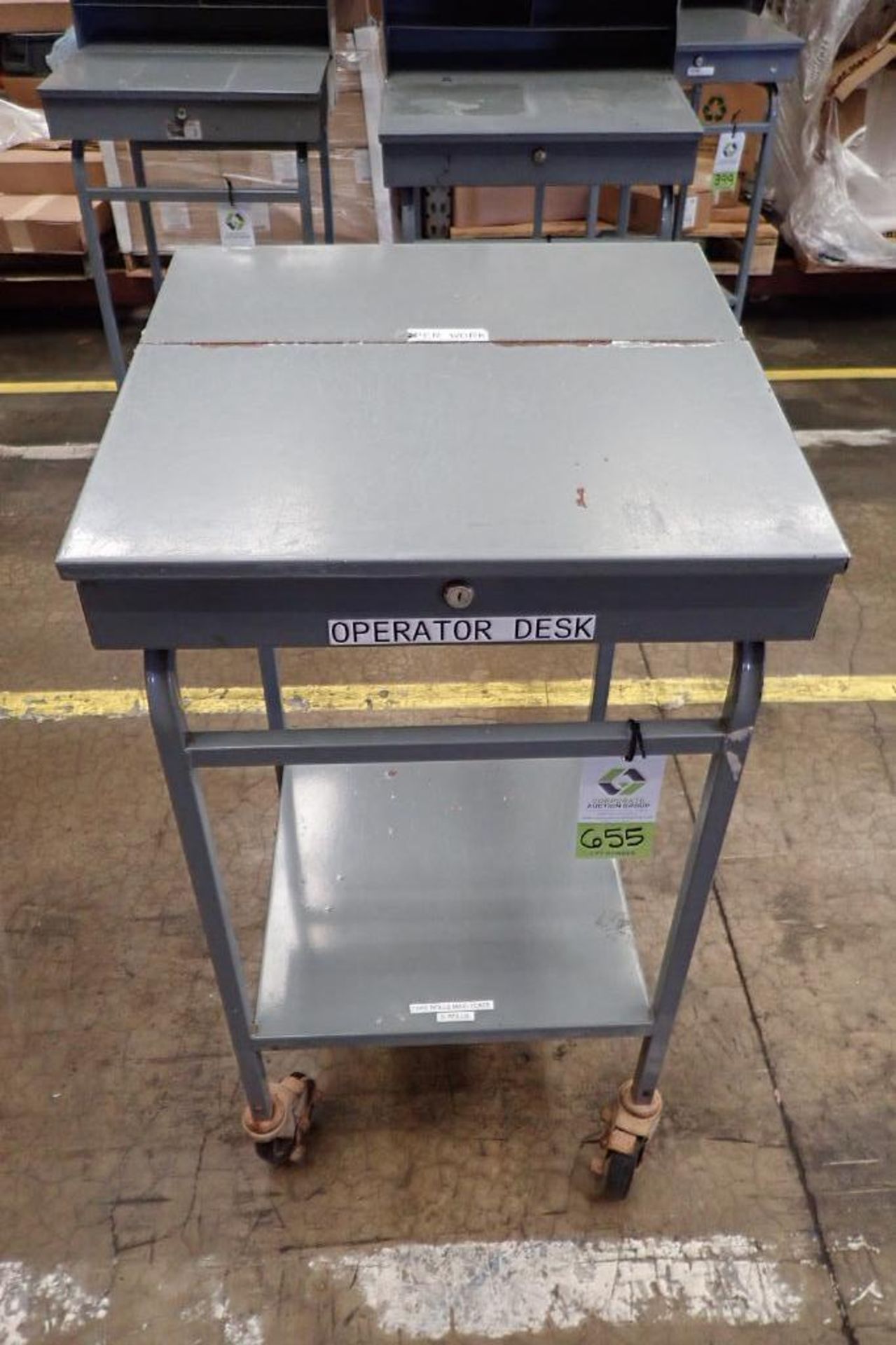 Win-Holt mild steel shipping desk on casters. **Rigging Fee: $10**