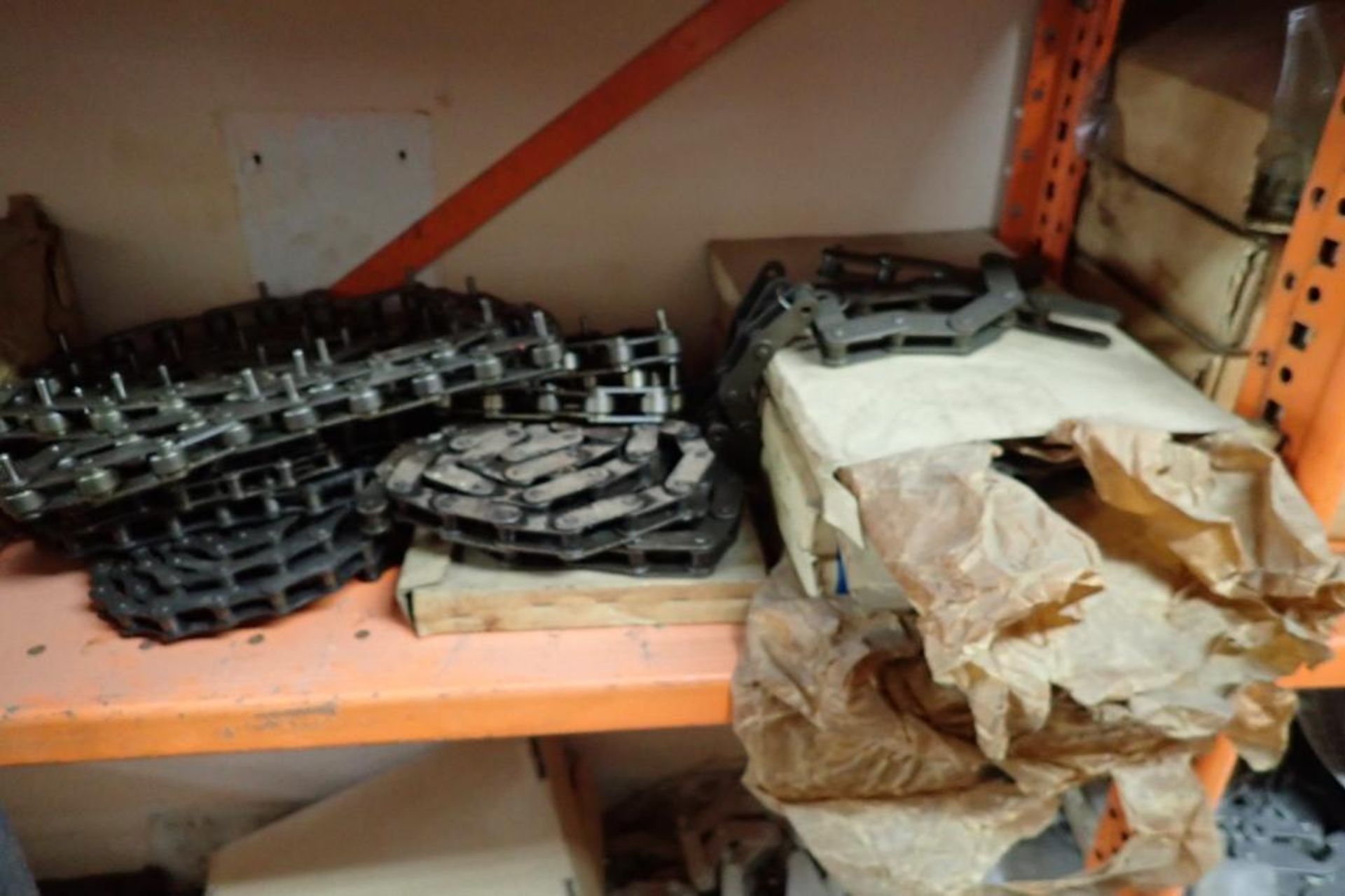 Contents only of 4 sections of shelving of assorted parts, gears, lug chain. **Rigging Fee: $150** - Image 20 of 21
