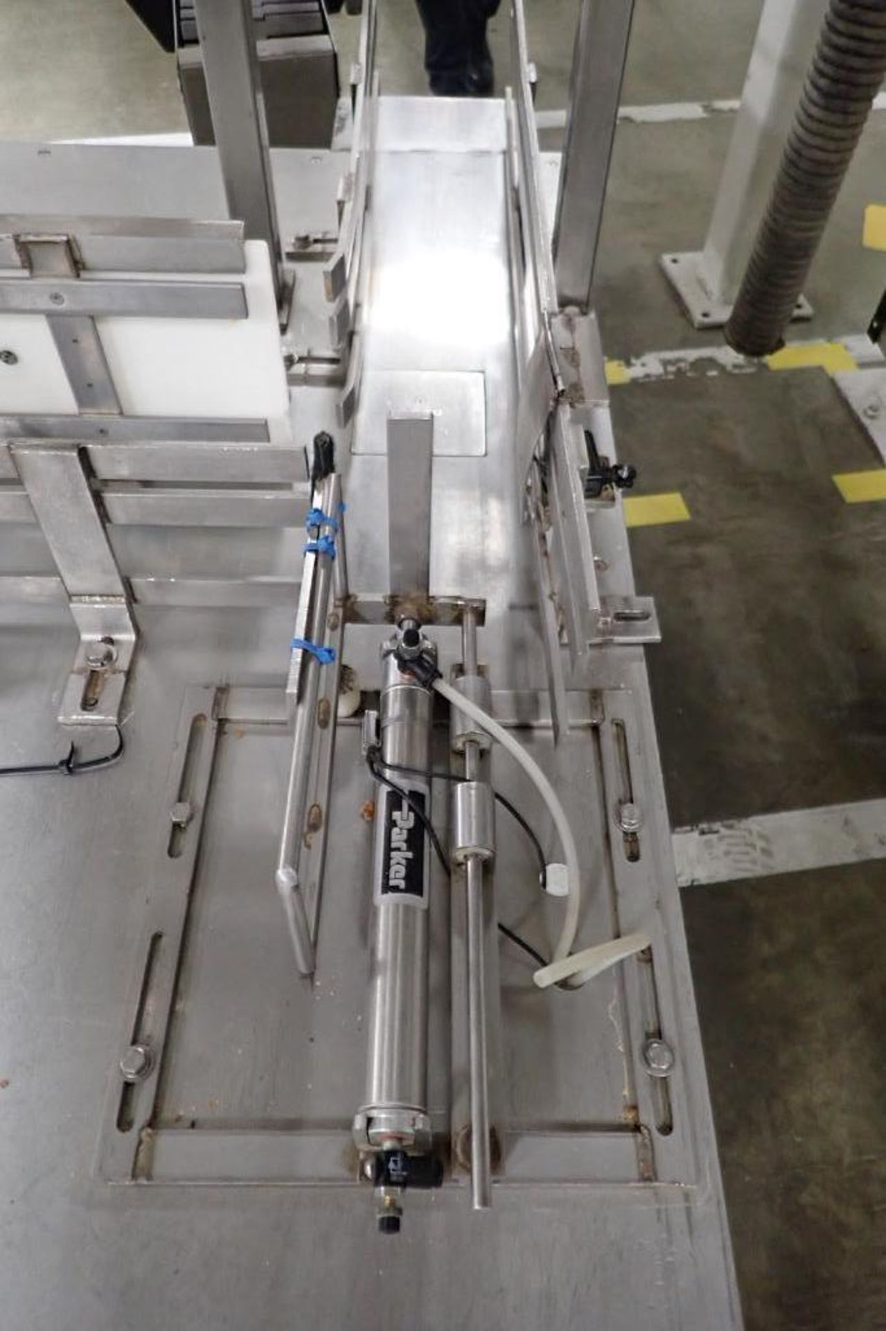 SS table on wheel, right angle feed to filling plastic jars, pneumatic push when full. **Rigging Fee - Image 3 of 8