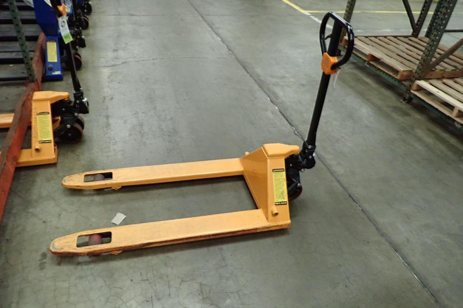 Global Industrial 5500 lb hand pallet jack, SN F695068, yellow. **Rigging Fee: $10**