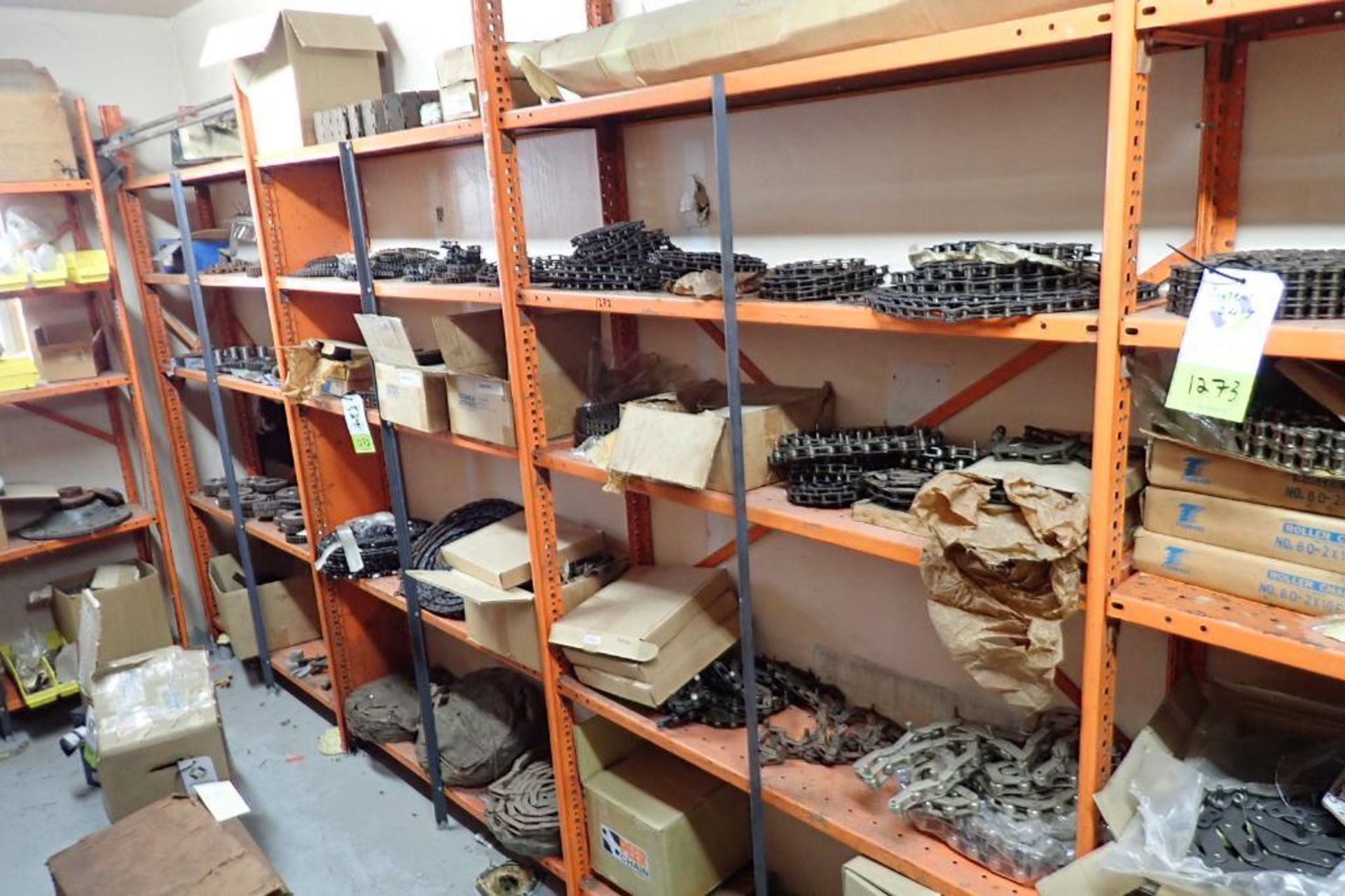 Contents only of 4 sections of shelving of assorted parts, gears, lug chain. **Rigging Fee: $150**