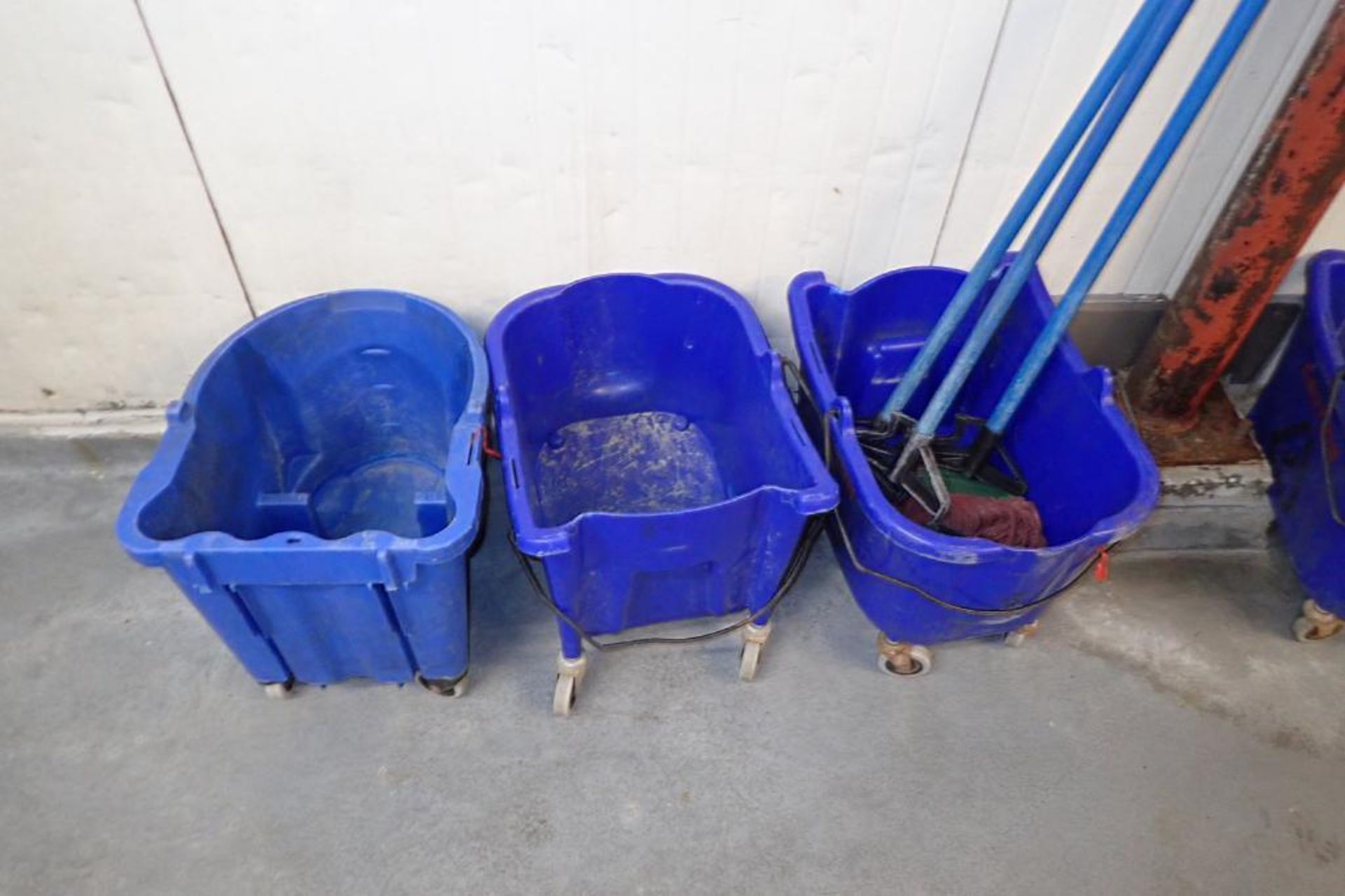 Blue mops and mop buckets, approximately 8. **Rigging Fee: $75** - Image 2 of 6