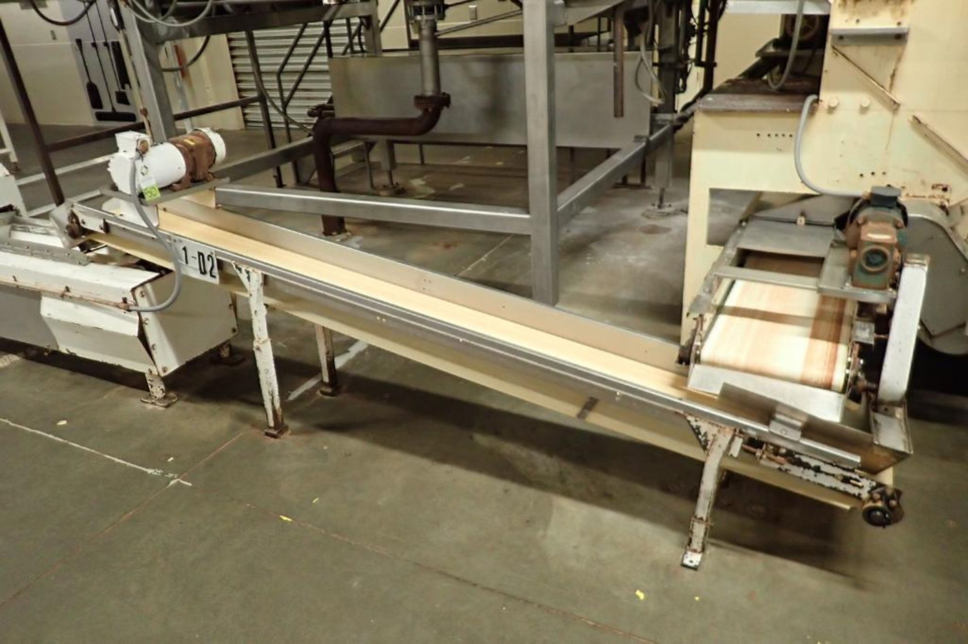 Incline belt conveyor, 10 ft. long x 12 in. wide x 16 in. infeed x 32 in. discharge, mild steel fram