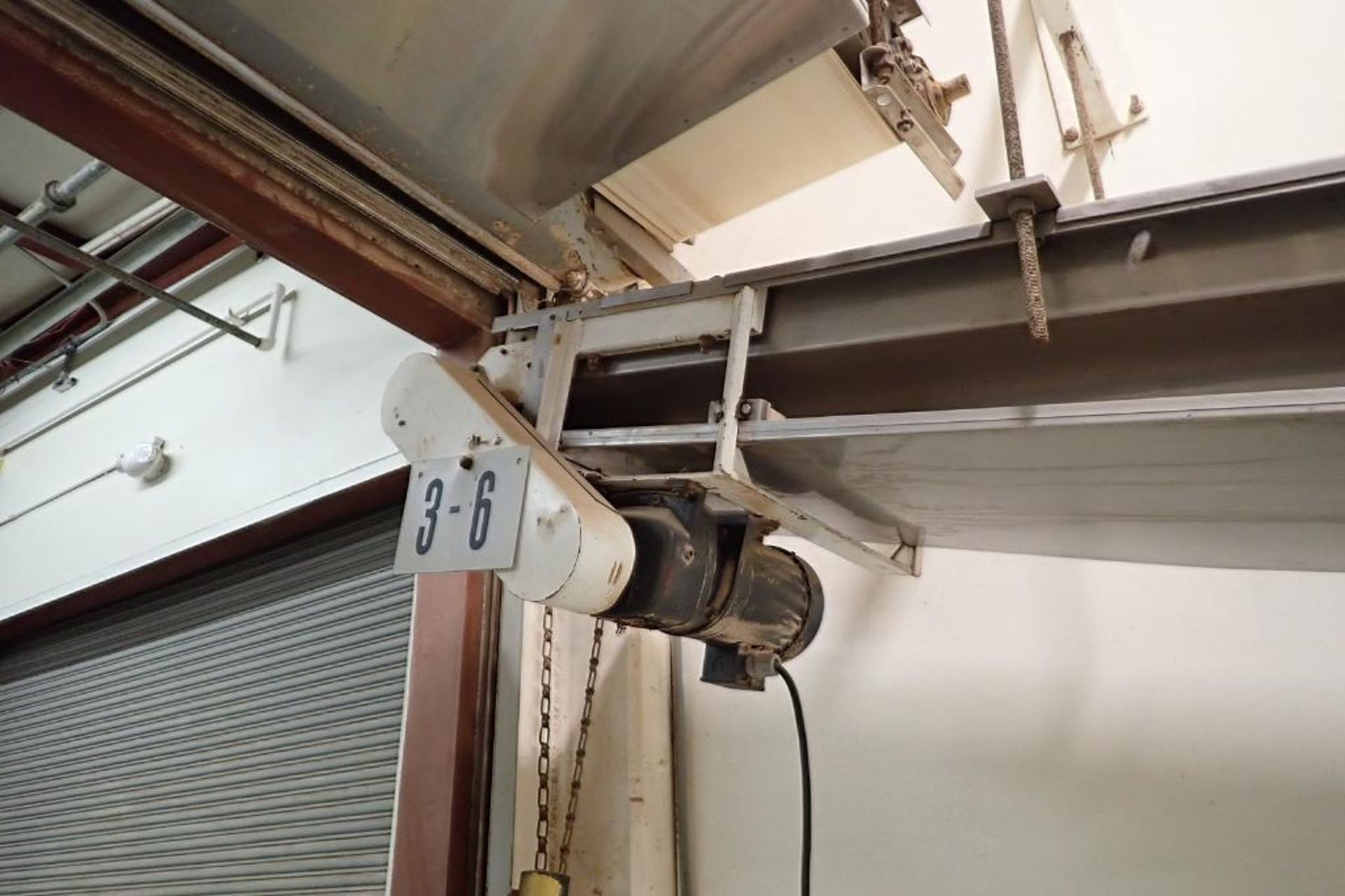 Mild Steel decline belt conveyor, 16 ft. long x 17 in. wide, suspended from ceiling. **Rigging Fee: - Image 2 of 4