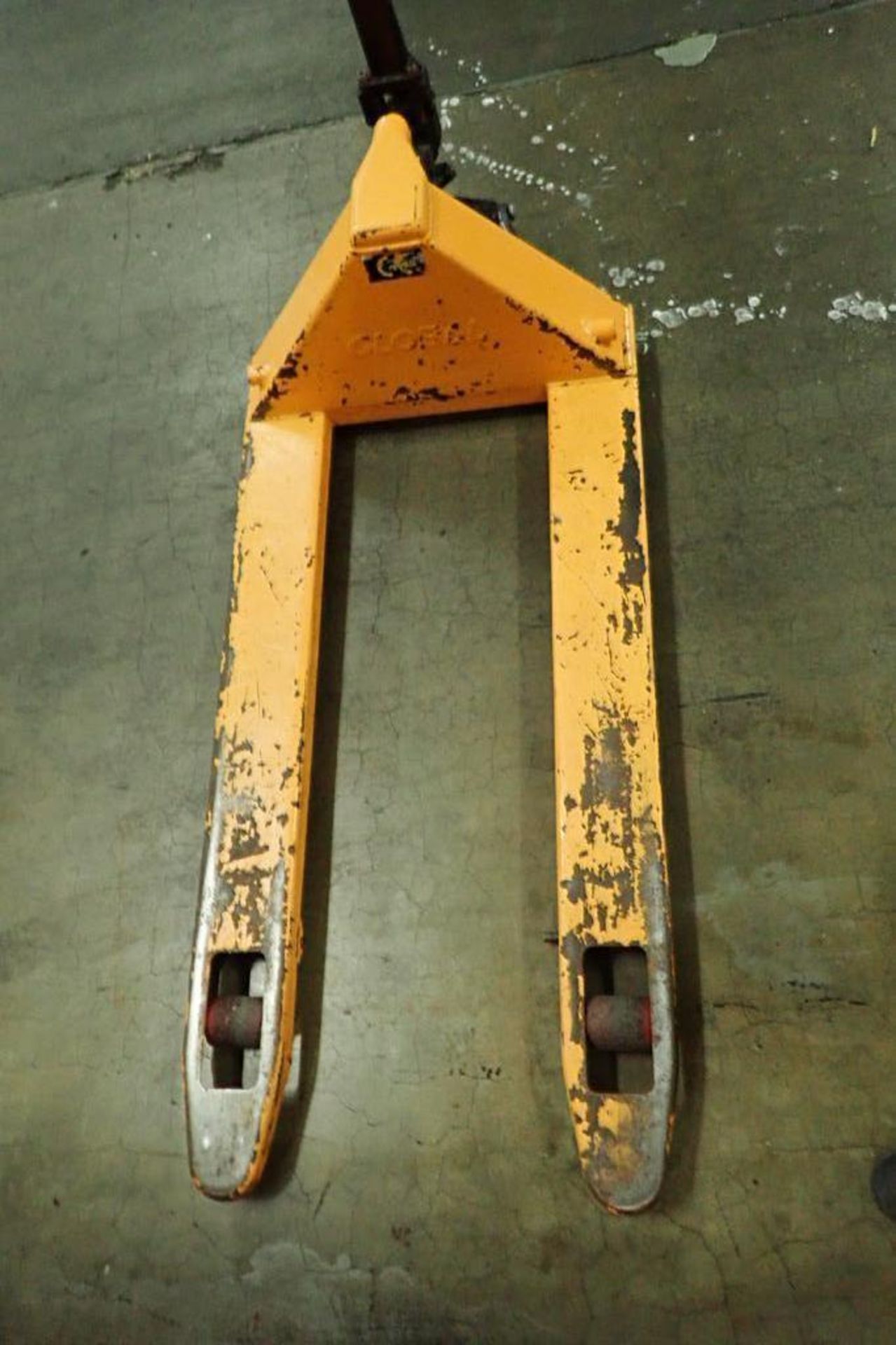 Global Industrial pallet jack, 5500 lb. capacity, SN E689044, yellow. **Rigging Fee: $10** - Image 4 of 5